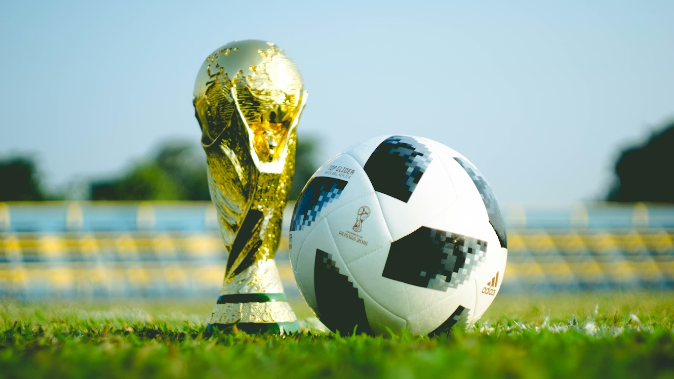 https://unsplash.com/photos/gold-colored-trophy-and-soccerball-cjYQBSKDSII