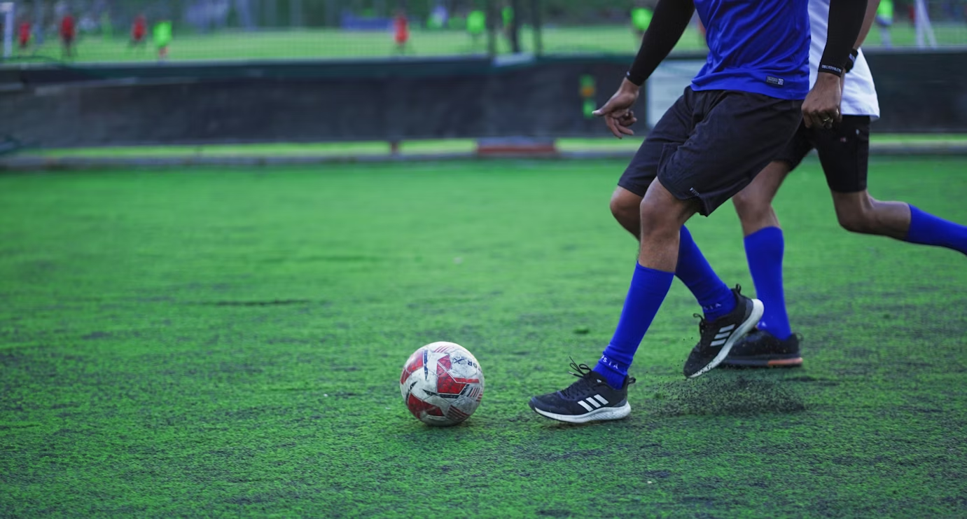 https://unsplash.com/photos/a-couple-of-men-playing-a-game-of-soccer-cap2QnWyQcQ